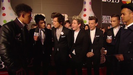 One Direction catches up with Rizzle Kicks on the 2013 BRIT Awards red carpet