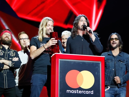 Foo Fighters accepting their award for International Group at The BRIT<span class='lowercase'>s</span>