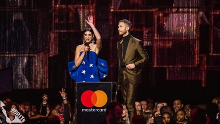 Dua Lipa and Calvin Harris accepting their BRIT Award