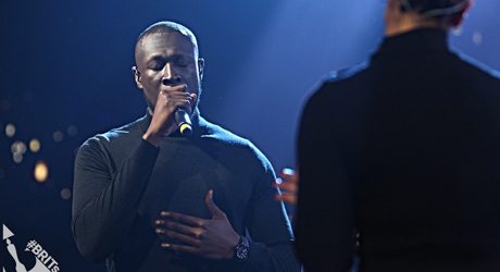 Stormzy on stage with Jorja Smith at The BRIT<span class='lowercase'>s</span> 2018 Nominations Show