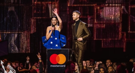 Dua Lipa and Calvin Harris accepting their BRIT Award